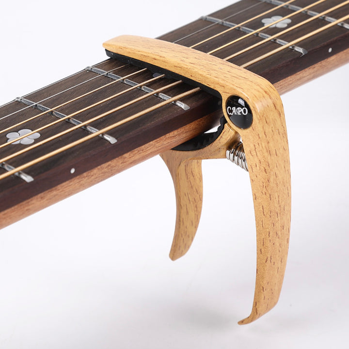 Acoustic Guitar Capo With Built In Pick Holder